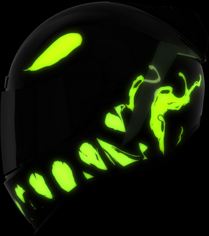 Black helmet with green glowing designs on a black background
